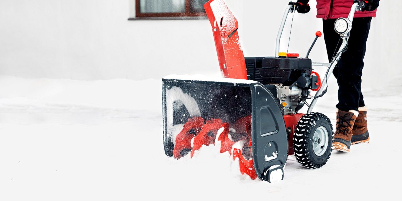 Person using a snow blower in deep snow
