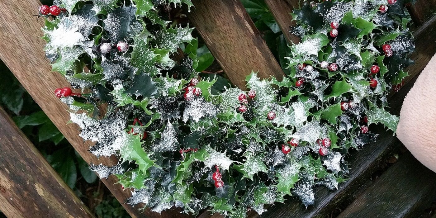Winter wreath with red berries and snow
