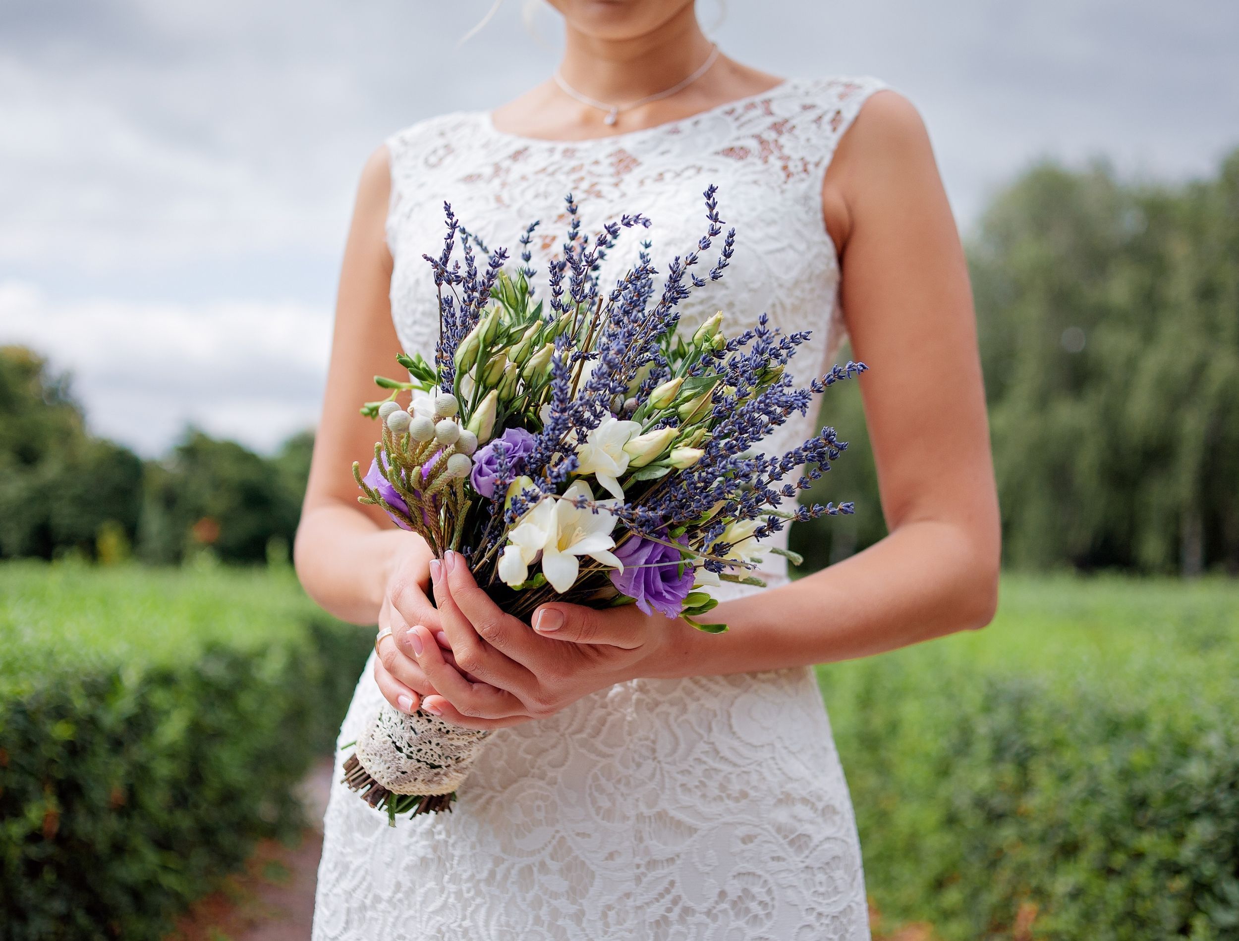 Bride holding a fragrant bouquet with lavender