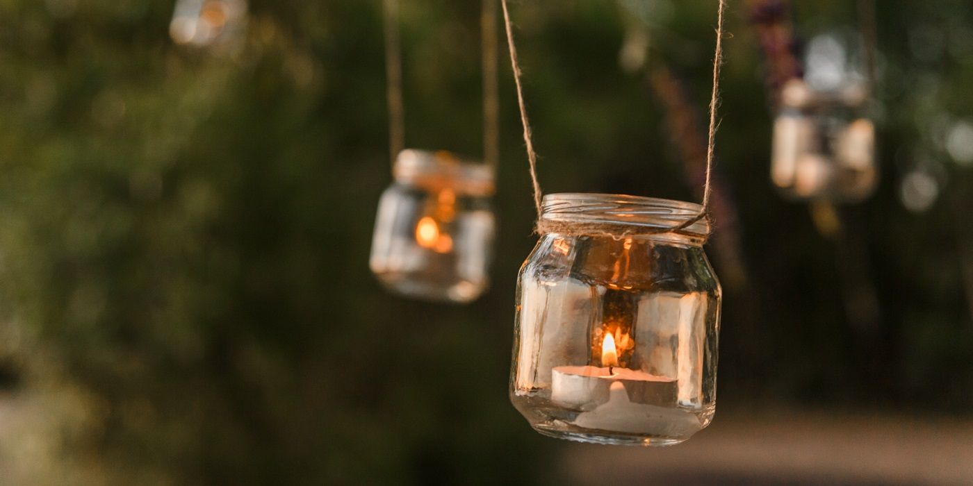 DIY mason jar lights with tea lights hanging outside