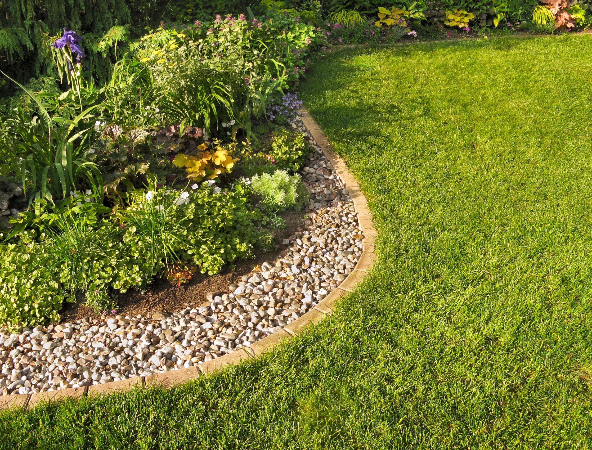 lawn border made of pebbles and stone 