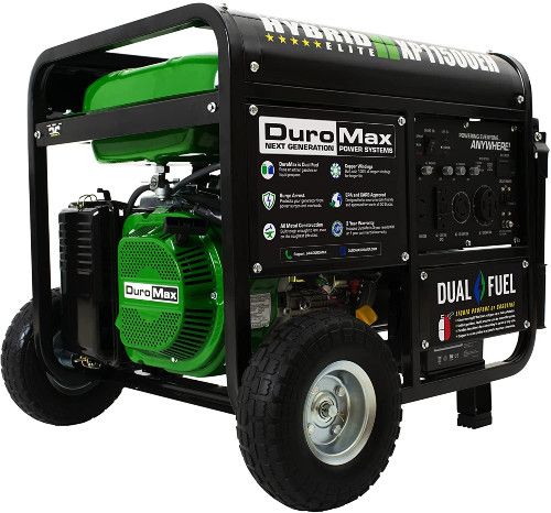 Large black and green generator on wheels, on white background