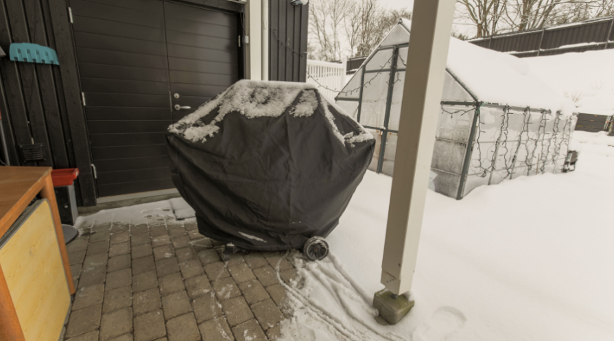 View of outdoor grill under cover for winter season