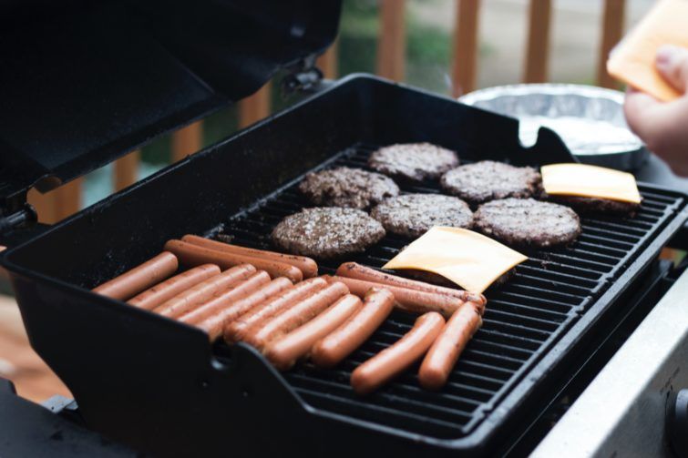 Burgers and sausages on a grill