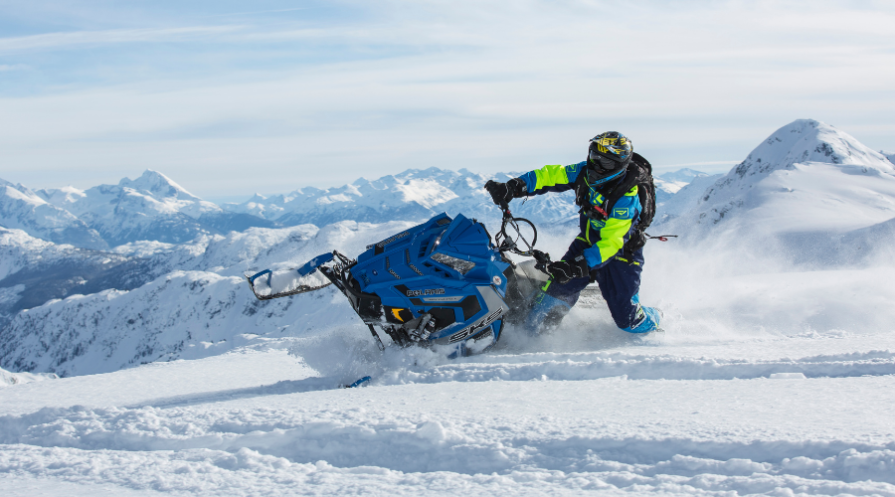 Man Riding Blue Snow Ski Scooter