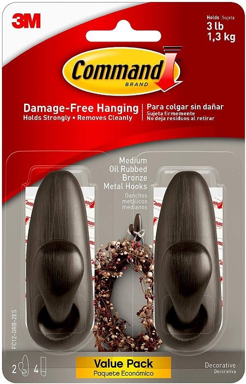 a package with two metallic command hooks
